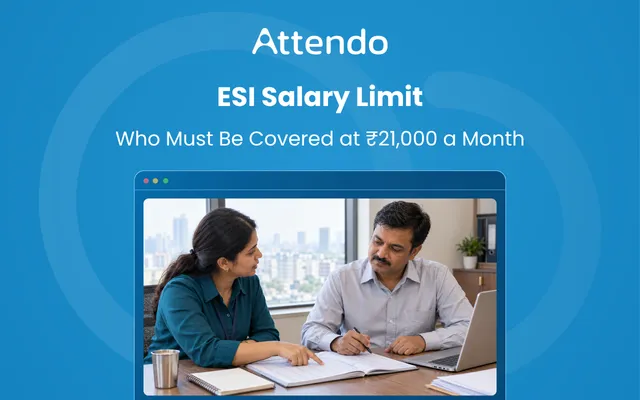 ESI salary limit explained: who must be covered at ₹21,000 a month. Two colleagues in an Indian office check a payroll register together.
